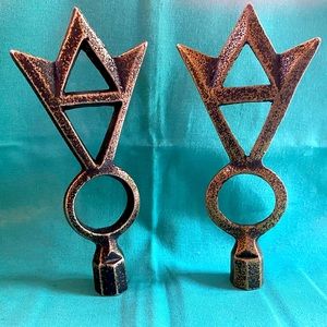 A pair of tall, metal, antiqued gold lamp finials.